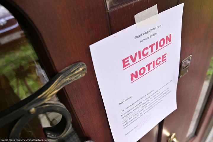 An eviction notice on a front door.