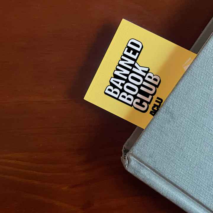 An ACLU bookmark sticking out of a book.