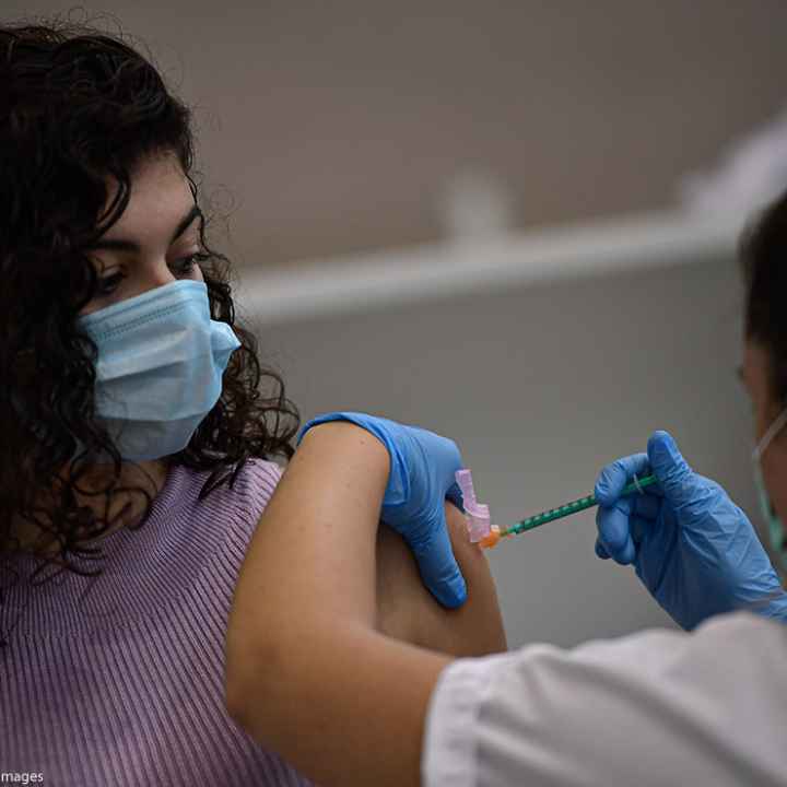 A woman receives the Pfizer COVID-19 vaccine, Thursday, Sept. 2, 2021.