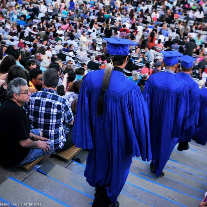 A Native American student is wearing an eagle feather to his high school graduation.