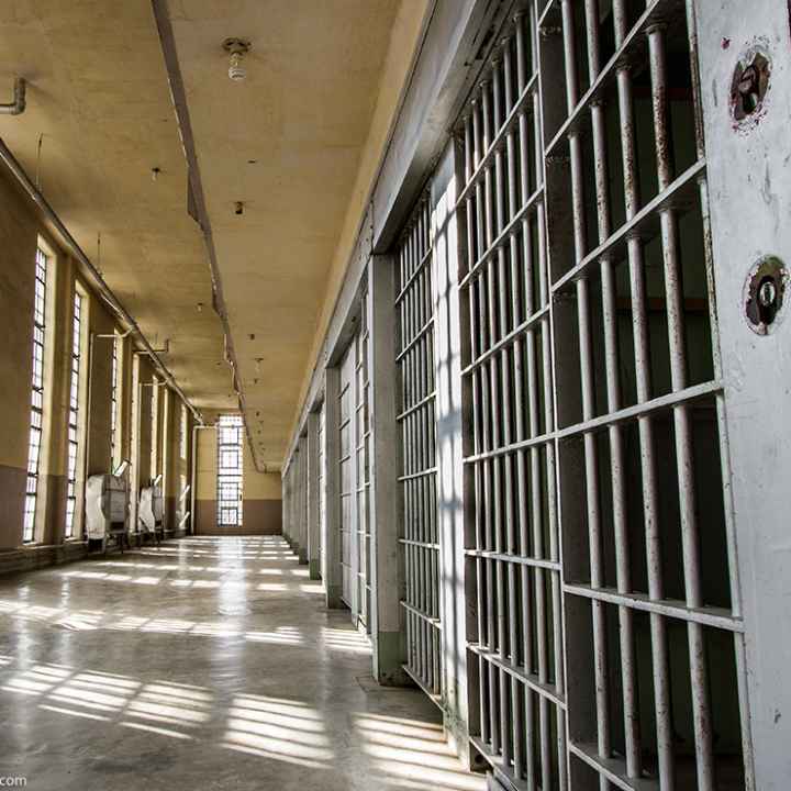 Prison cells and empty hallway