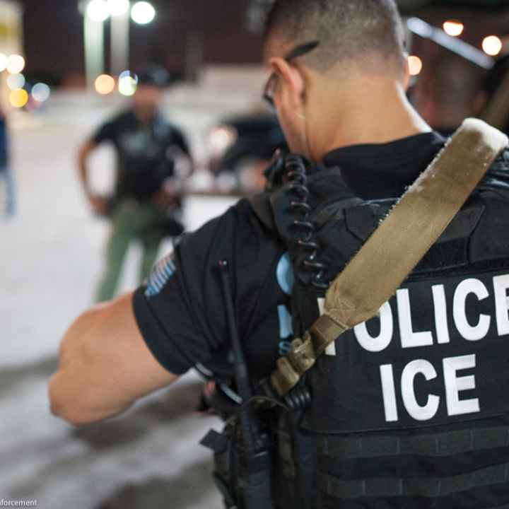 The back of a police vest reads "Police ICE"