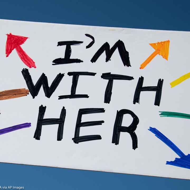 A protest sign that reads, "I'm With Her"