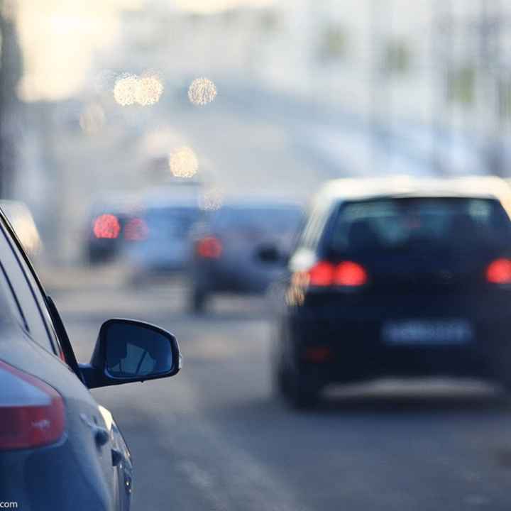 Cars driving on a highway.