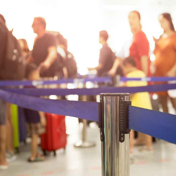 People waiting in line at an airport.